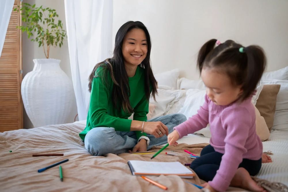 certified-occupational-therapy-assistant with a baby girl on the sofa