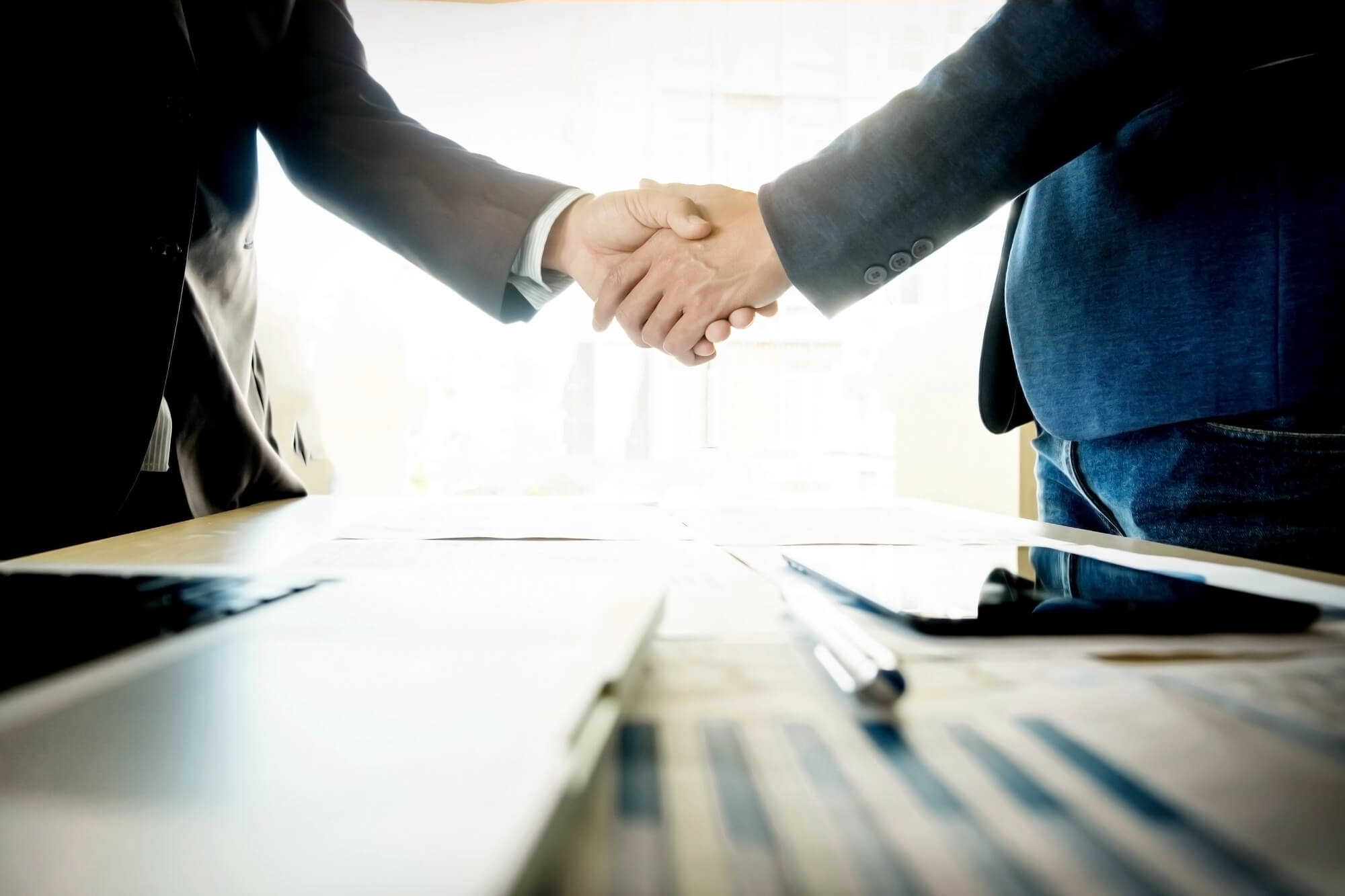 shaking hands after deciding to Sell My Business