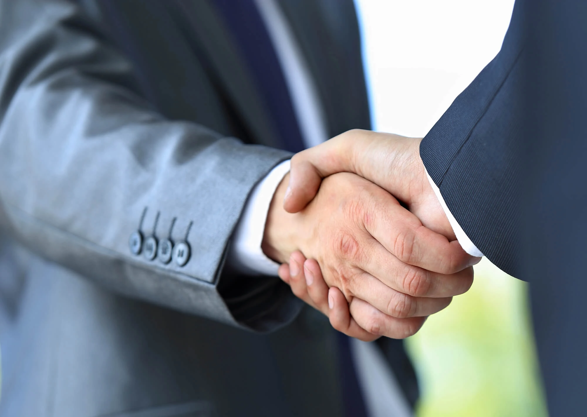 shaking hands after Selling My Business for Top Dollar