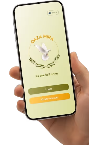Hand holding a smartphone displaying a login screen with a white dove logo, text 'Oaza Mira' and buttons for 'Login' and 'Create Account'.