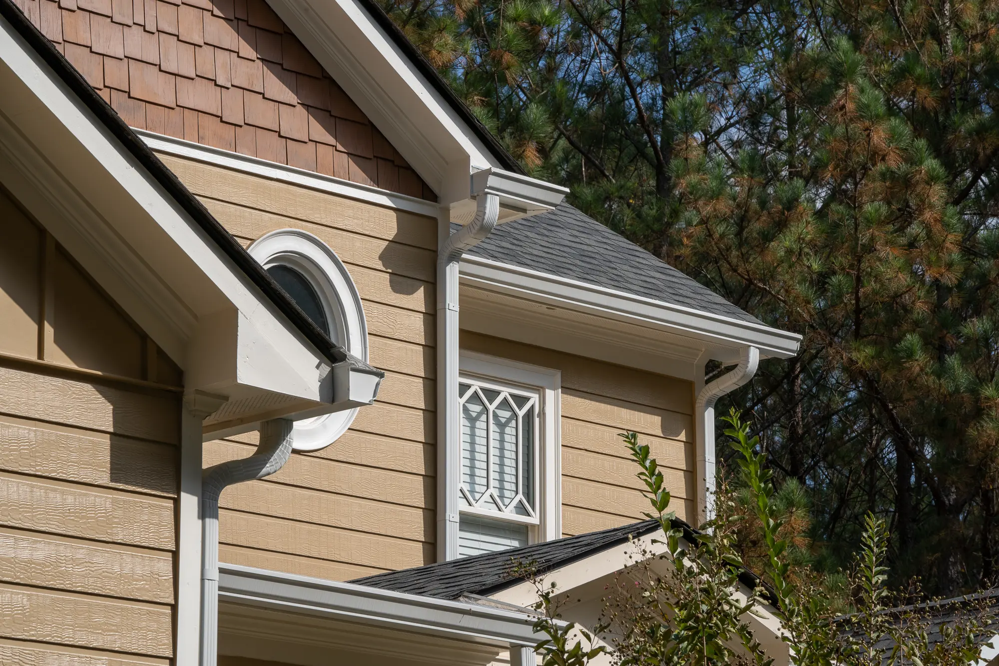 Downspout of a 2 story yellow house