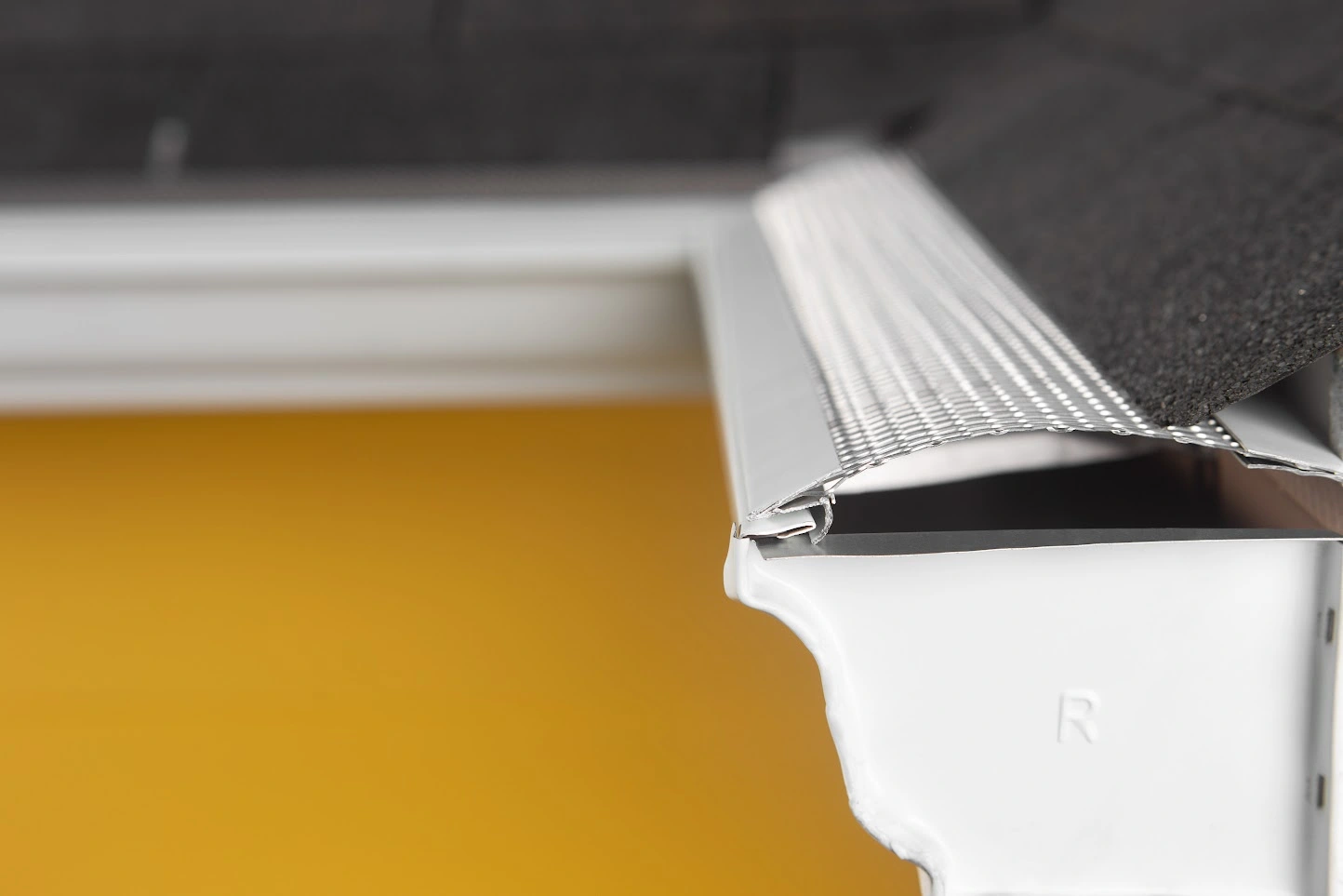 Gutter Guard on a yellow house