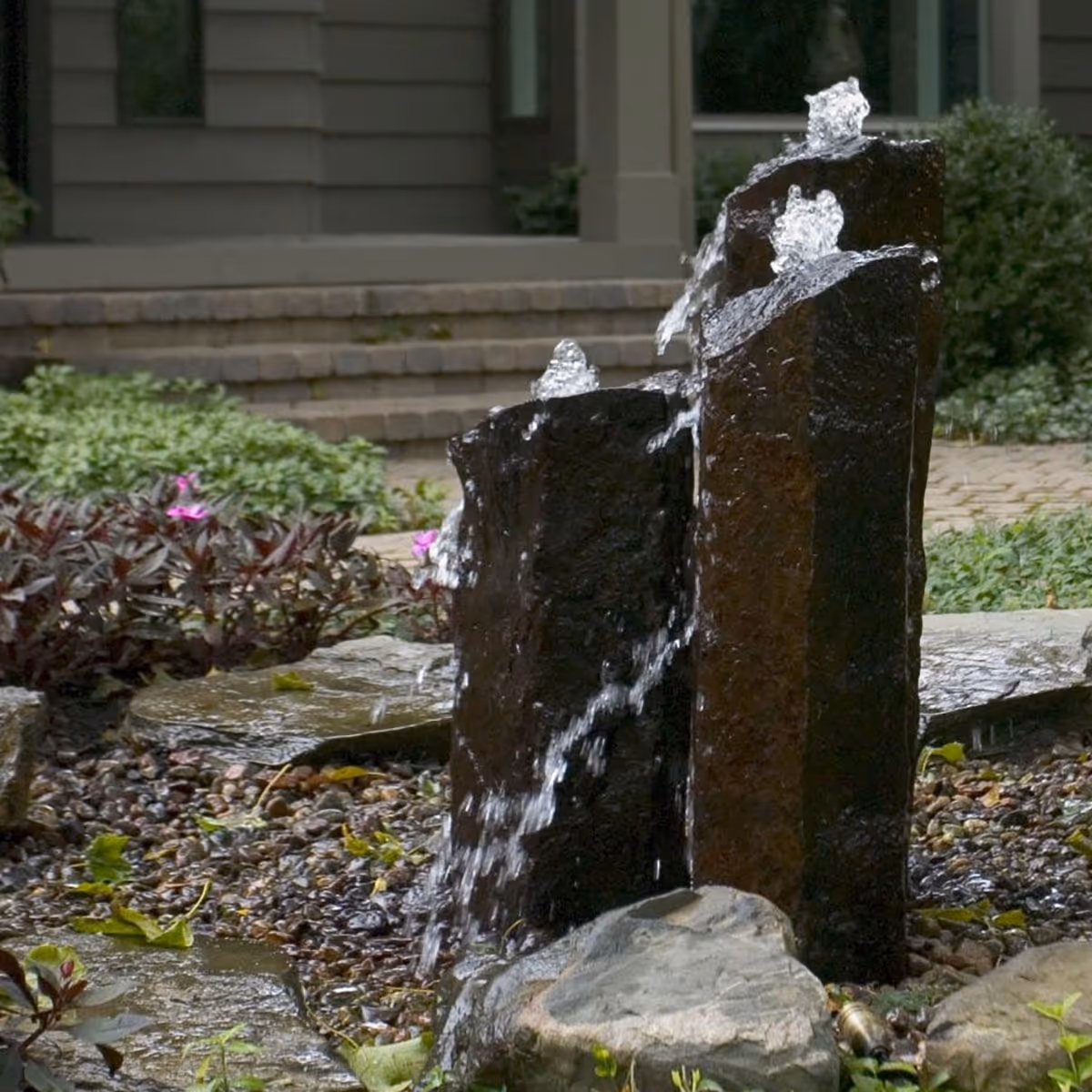 Custom stone fountain water feature installed by Triscapes near me
