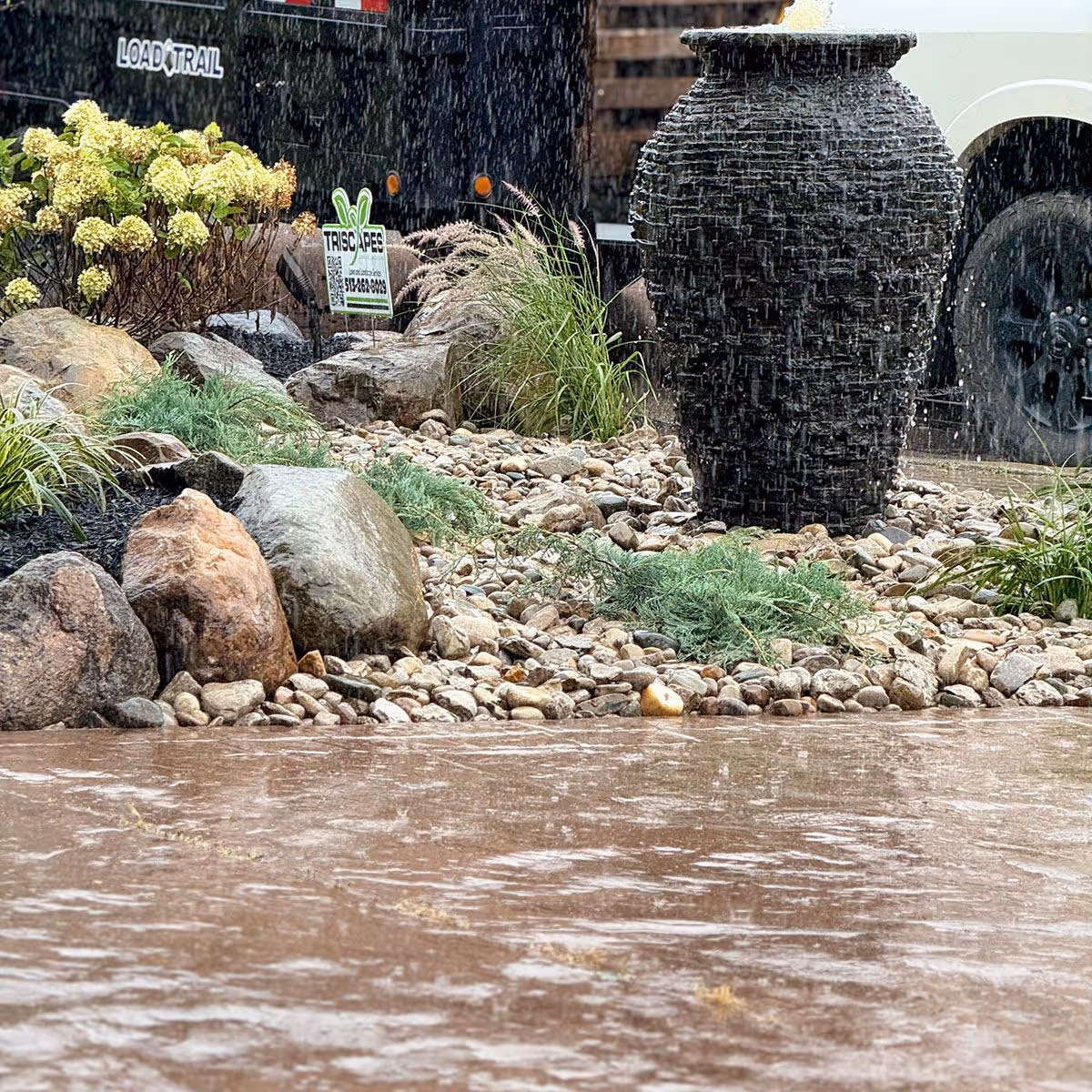 Front yard landscape makeover showcasing colorful shrubs and hardscape edge