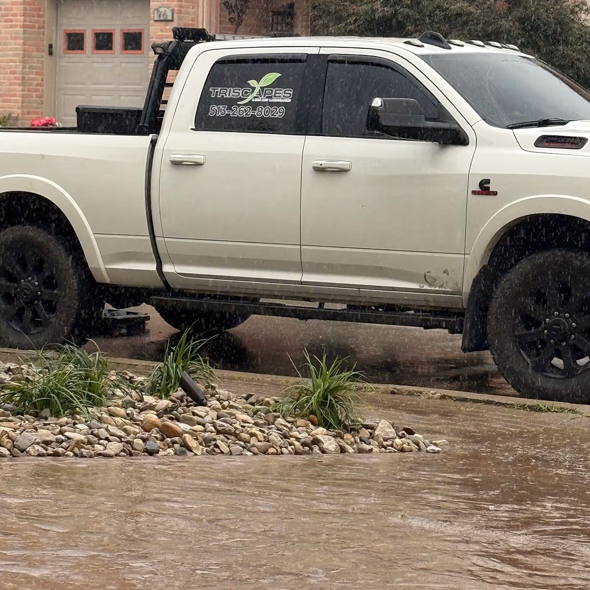 Triscapes landscaping truck loaded with equipment for hardscape installation