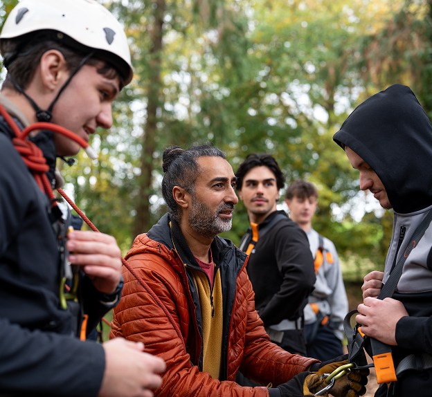 Group of participants engaging in outdoor adventure training at Hilston Park, reflecting the brand's spirit & engaging experience.