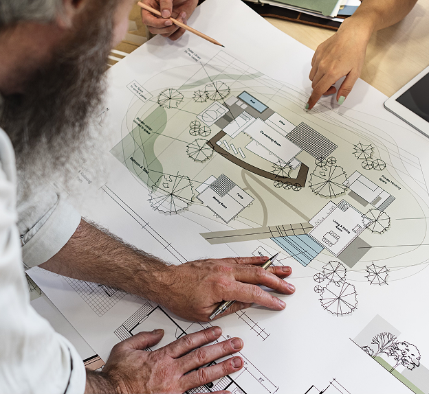 Architectural team collaborating on plans, supported by 5rv Digital’s digital marketing for property management.