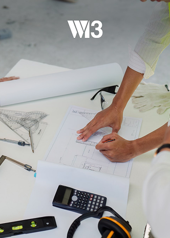 Architect marking measurements on detailed plans, symbolising strategic architect branding and visual identity development.