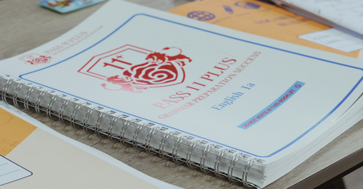 A notebook with a red rose on a wooden desk, styled for 5rv Digital’s seo for educational institutions.