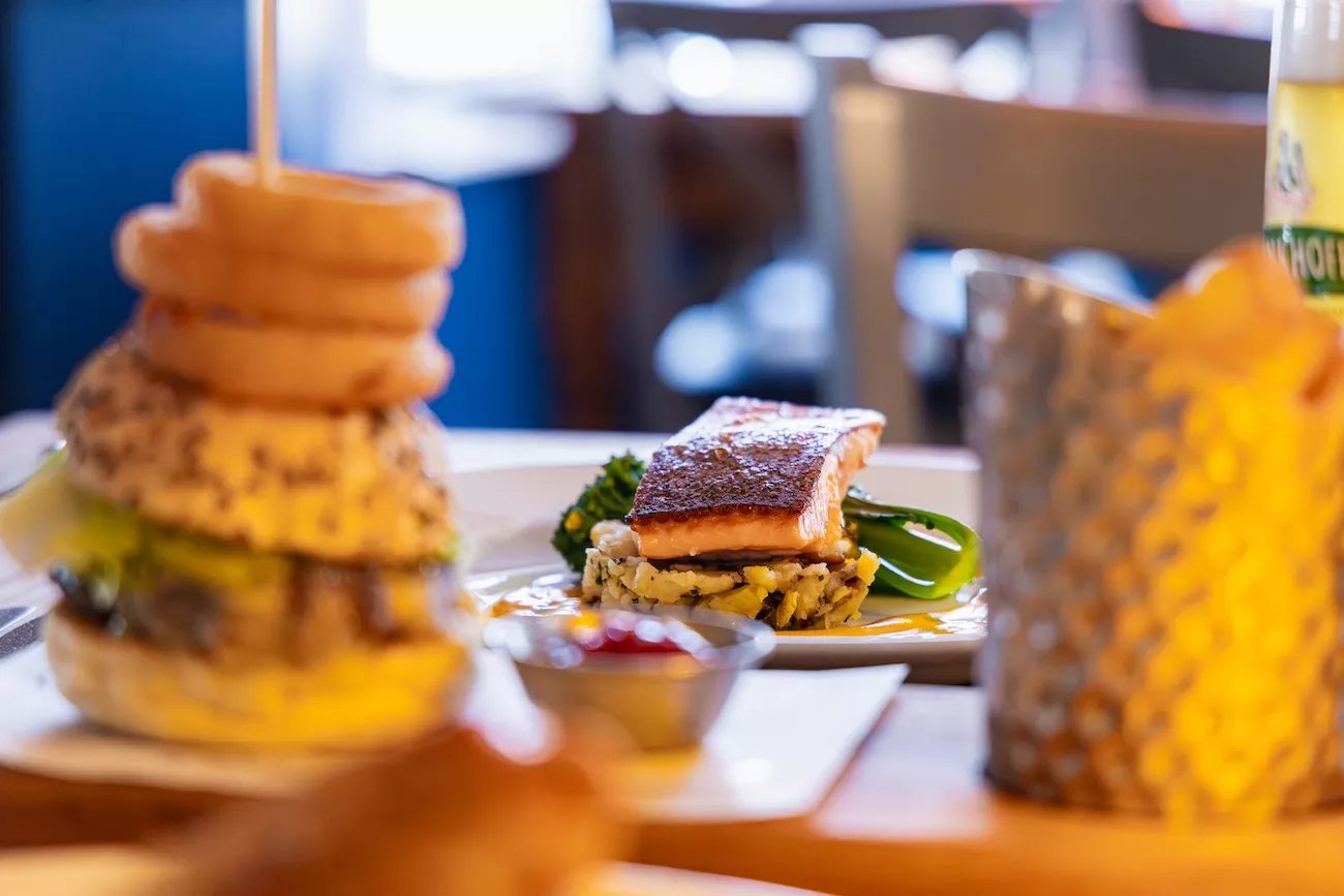 Pan-seared salmon and loaded burger served at The Bridge Inn & Ferry, one of the best places to eat near Evesham
