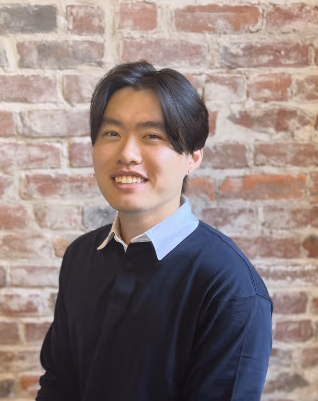 headshot of man in sweater