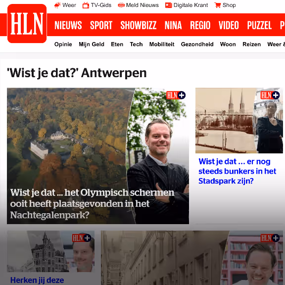 Screenshot of HLN news webpage with 'Wist je dat?' Antwerp section showing aerial park, a man smiling, and historical images with Dutch text about Olympic fencing and bunkers in the city.