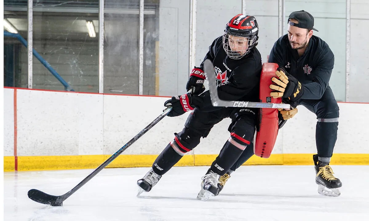 Hockey player learning puck protection skills at RHA Christmas Break Hockey Camp Toronto