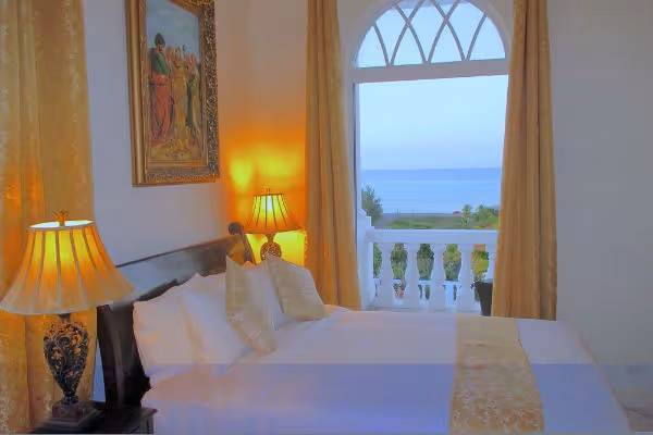 a bedroom with a large window