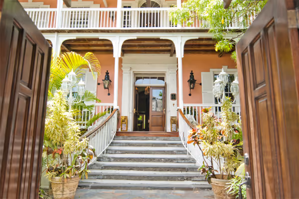 a vase of flowers sits in front of a building