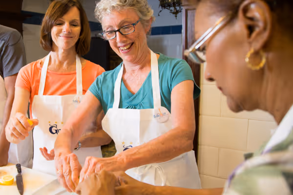 a woman preparing food in a kitchen