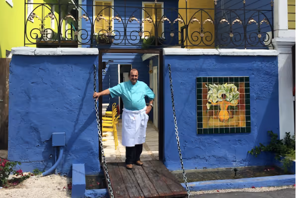 a man standing in front of a building