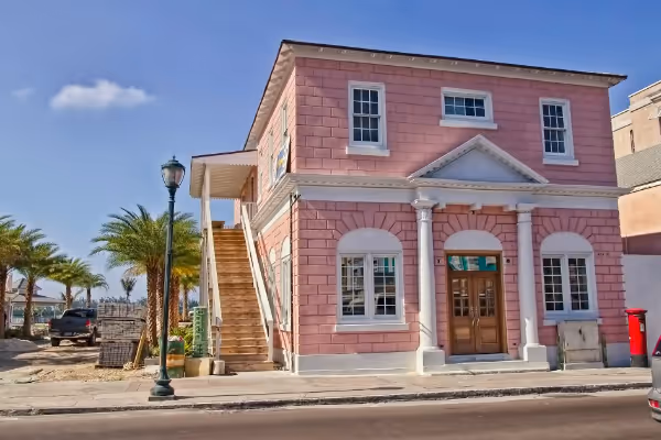 a car parked in front of a brick building