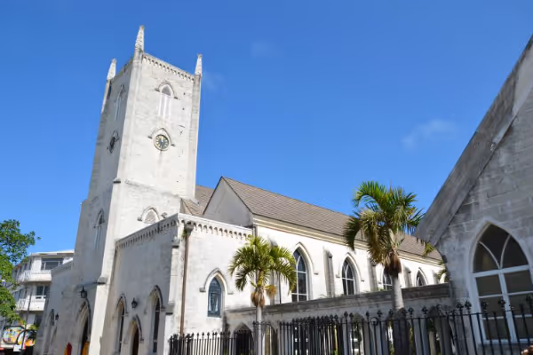 a church with a clock tower in front of a building