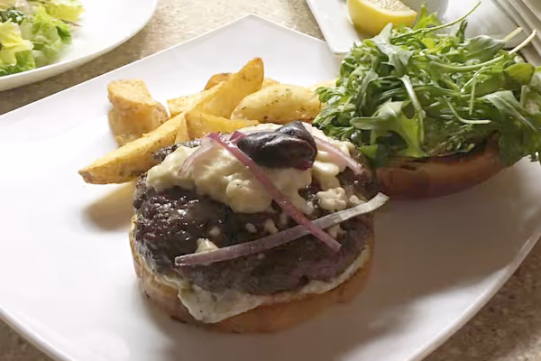 a plate of food with a sandwich and a salad