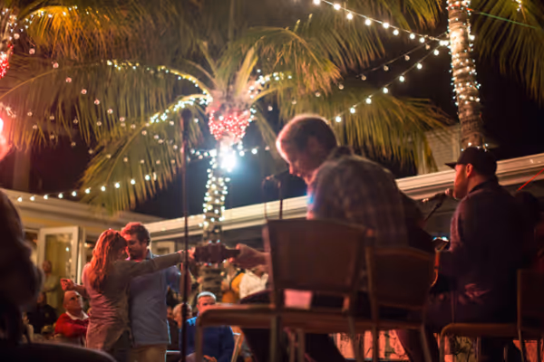 a group of people sitting in front of a crowd
