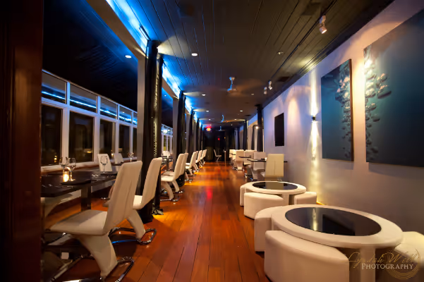 a room filled with furniture and a large window