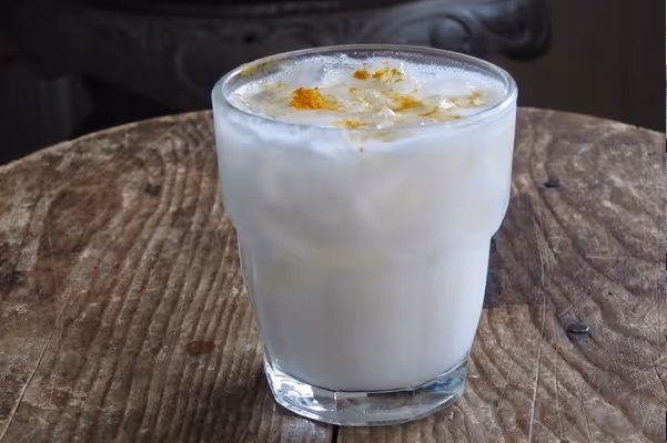 a cup of coffee and a glass of milk