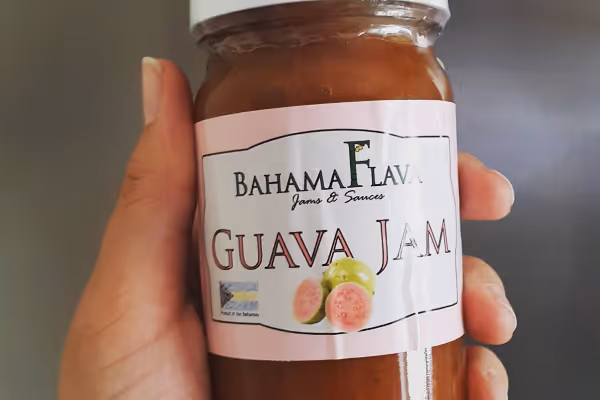 a hand holding a bottle