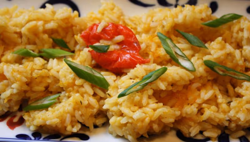 a plate of food with rice and vegetables