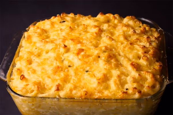 a pizza sitting on top of a metal pan