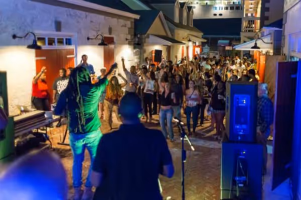 a group of people singing in front of a crowd