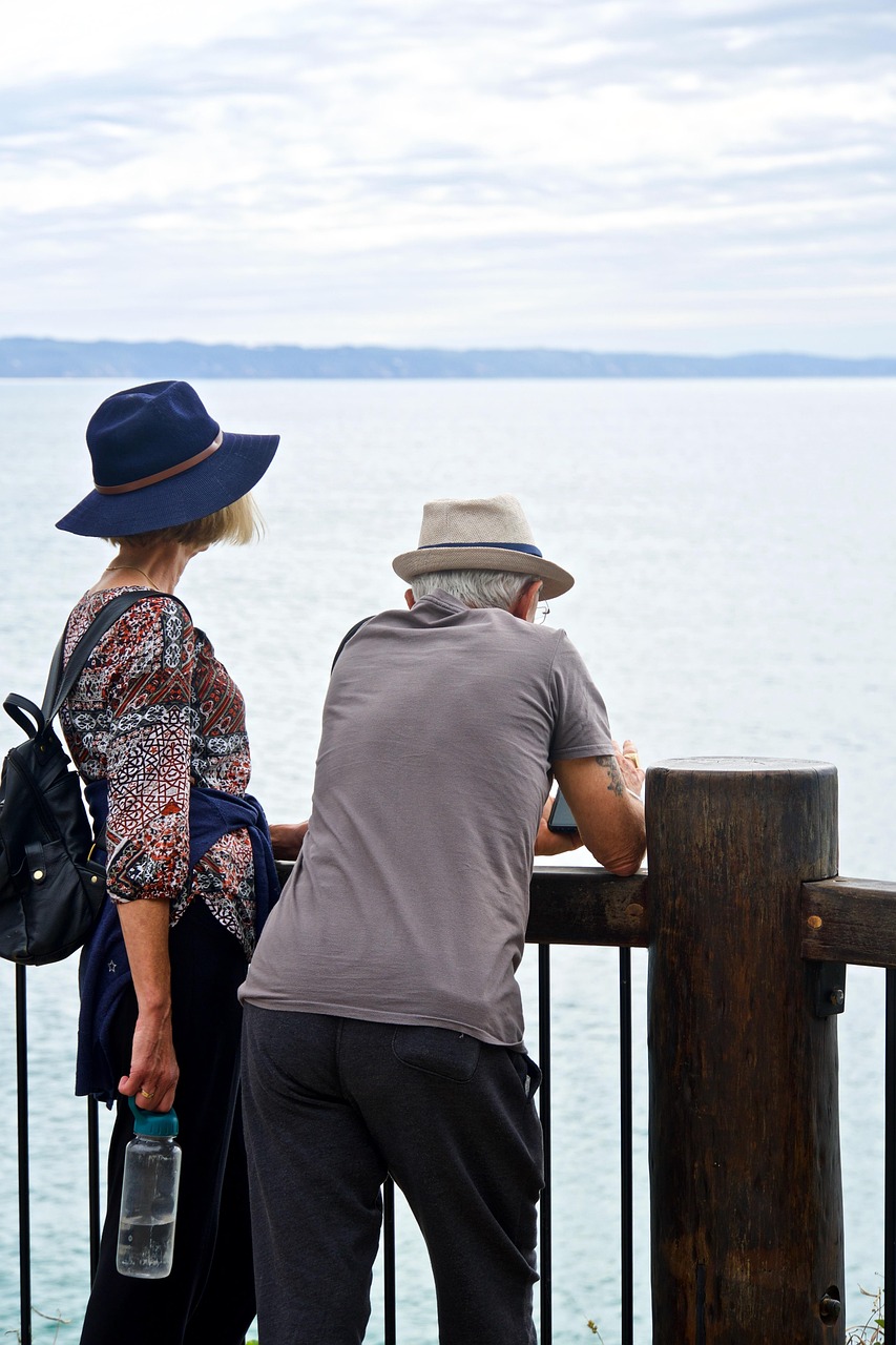 A couple sitting together in a quiet, thoughtful conversation