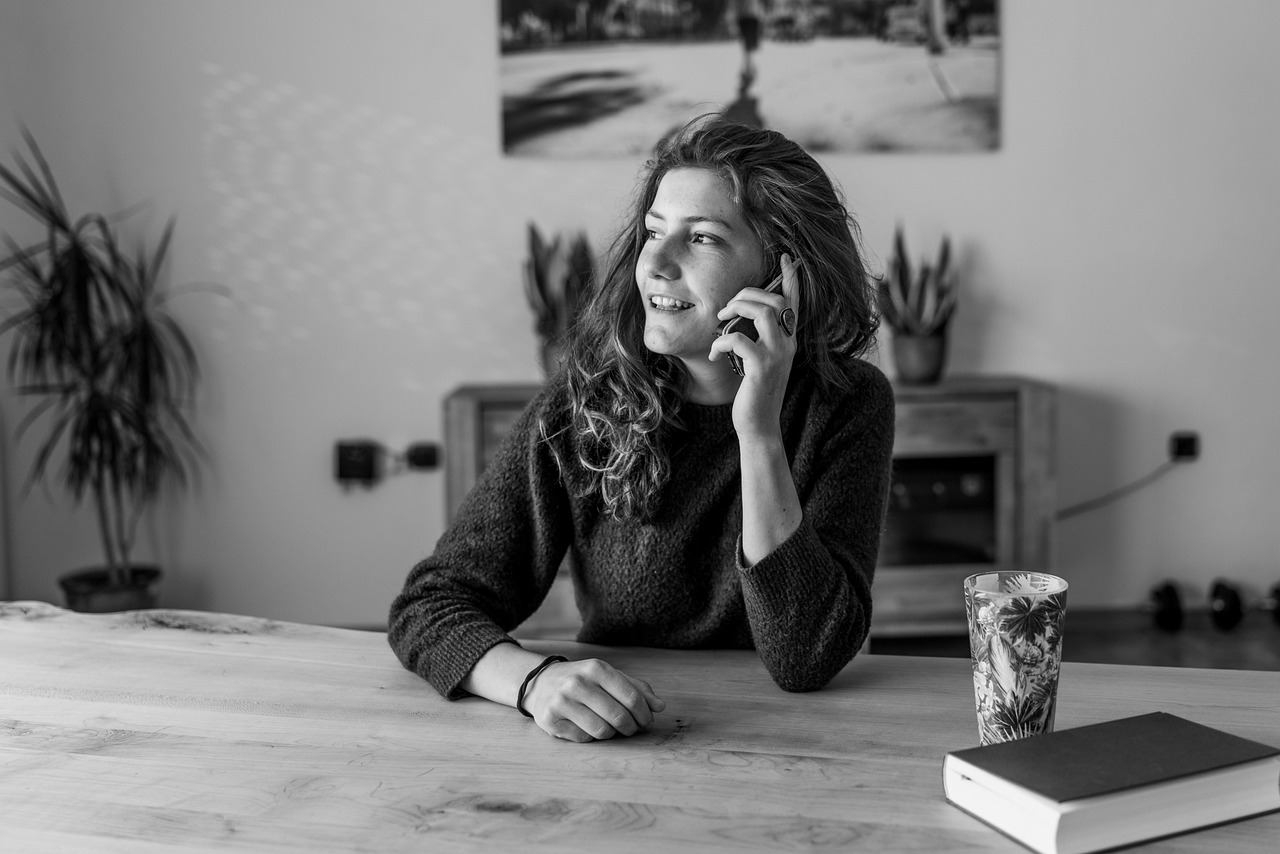 A person on a phone call, the intake conversation where a couples session is screened before booking
