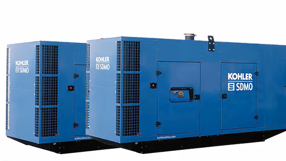 Two blue Kohler SDMO industrial generators positioned side by side.