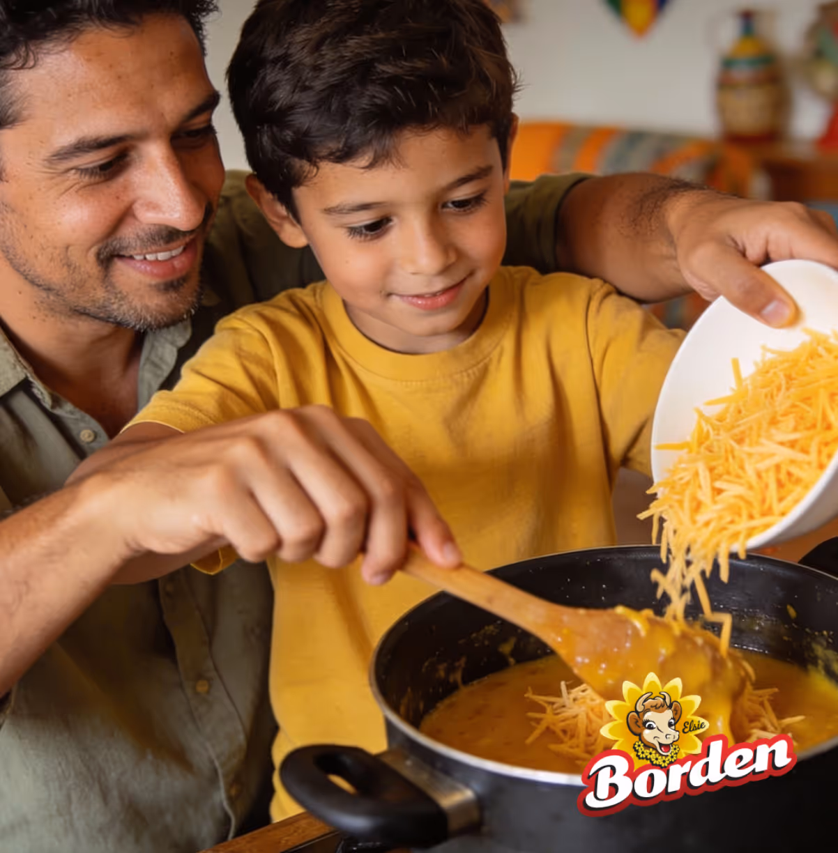 Father and son cooking together, with the boy adding shredded cheese to a pot of cheese sauce.