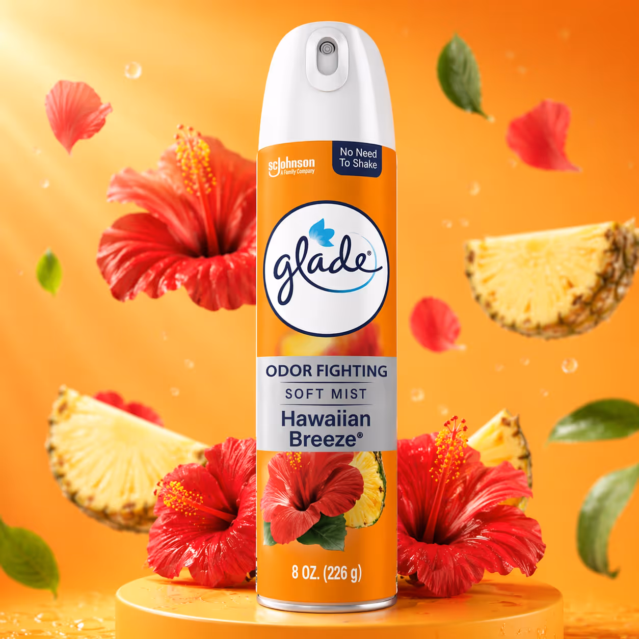 Glade Hawaiian Breeze odor fighting soft mist air freshener can with red hibiscus flowers and pineapple slices on an orange background.