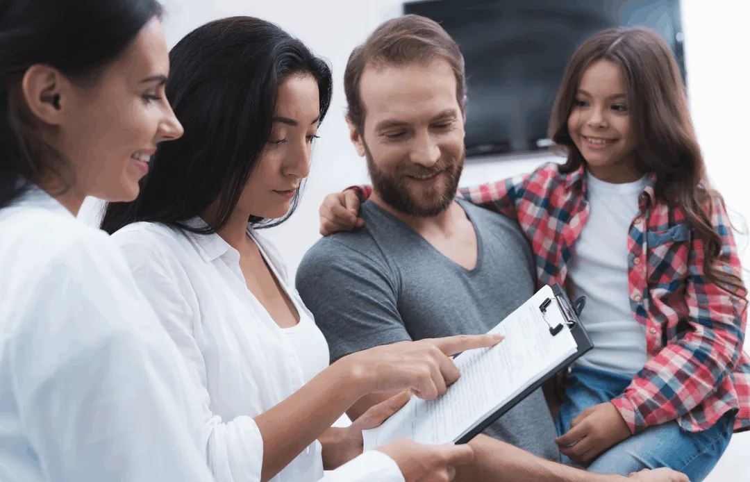 A group of people sitting next to each other.