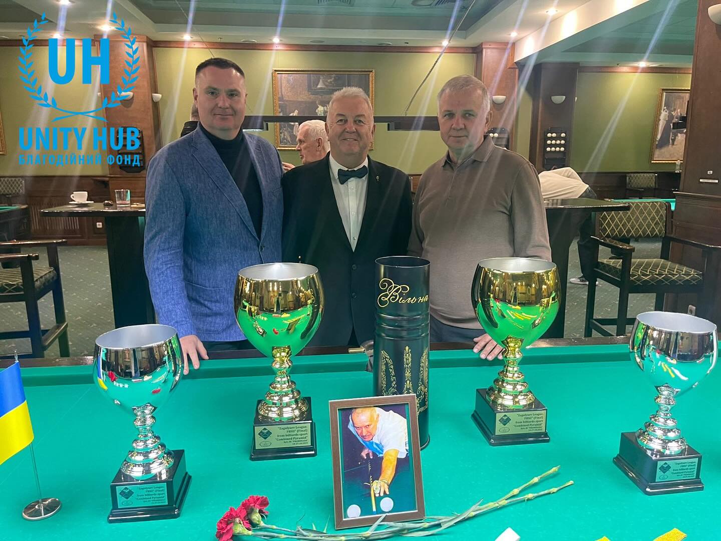 Unity HUB partnership at a billiards tournament: table with cups