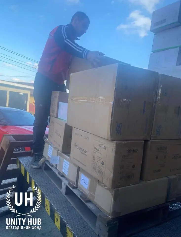 Pallets with boxes of honey products on the warehouse ramp