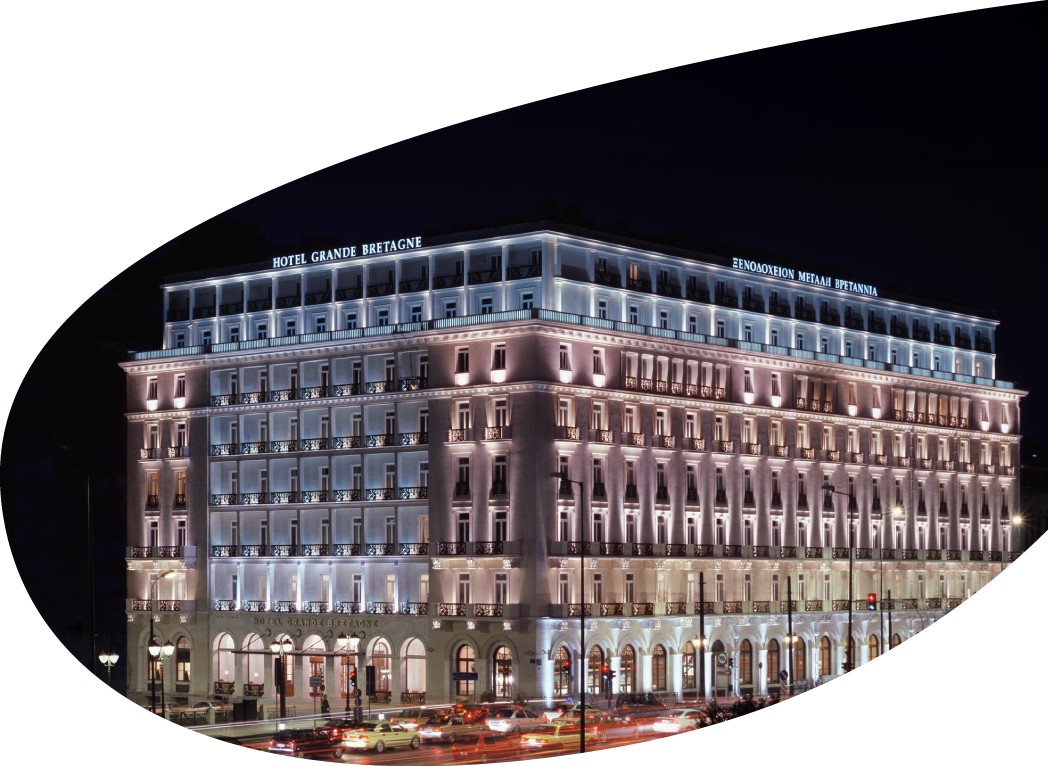 The exterior of the Hotel Grande Bretagne at nightfall.