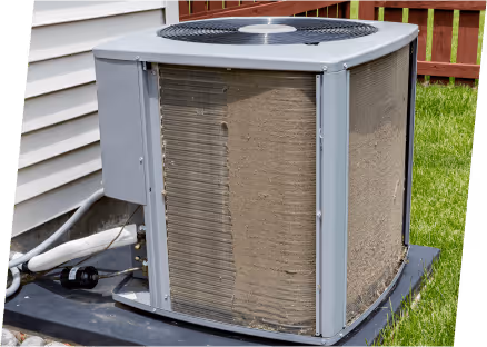 A heat pump displayed in front of a home.