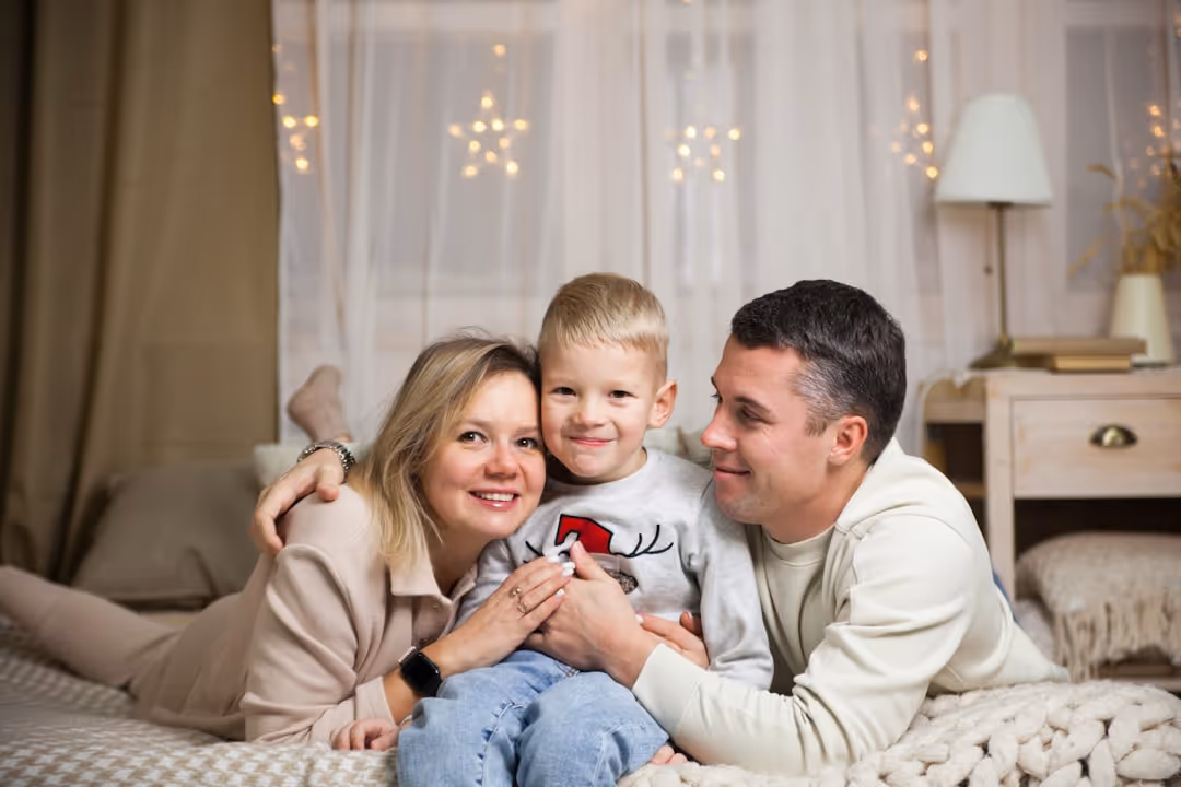 happy, healthy family relaxing in their comfortable living room - indoor air quality testing gilbert, az