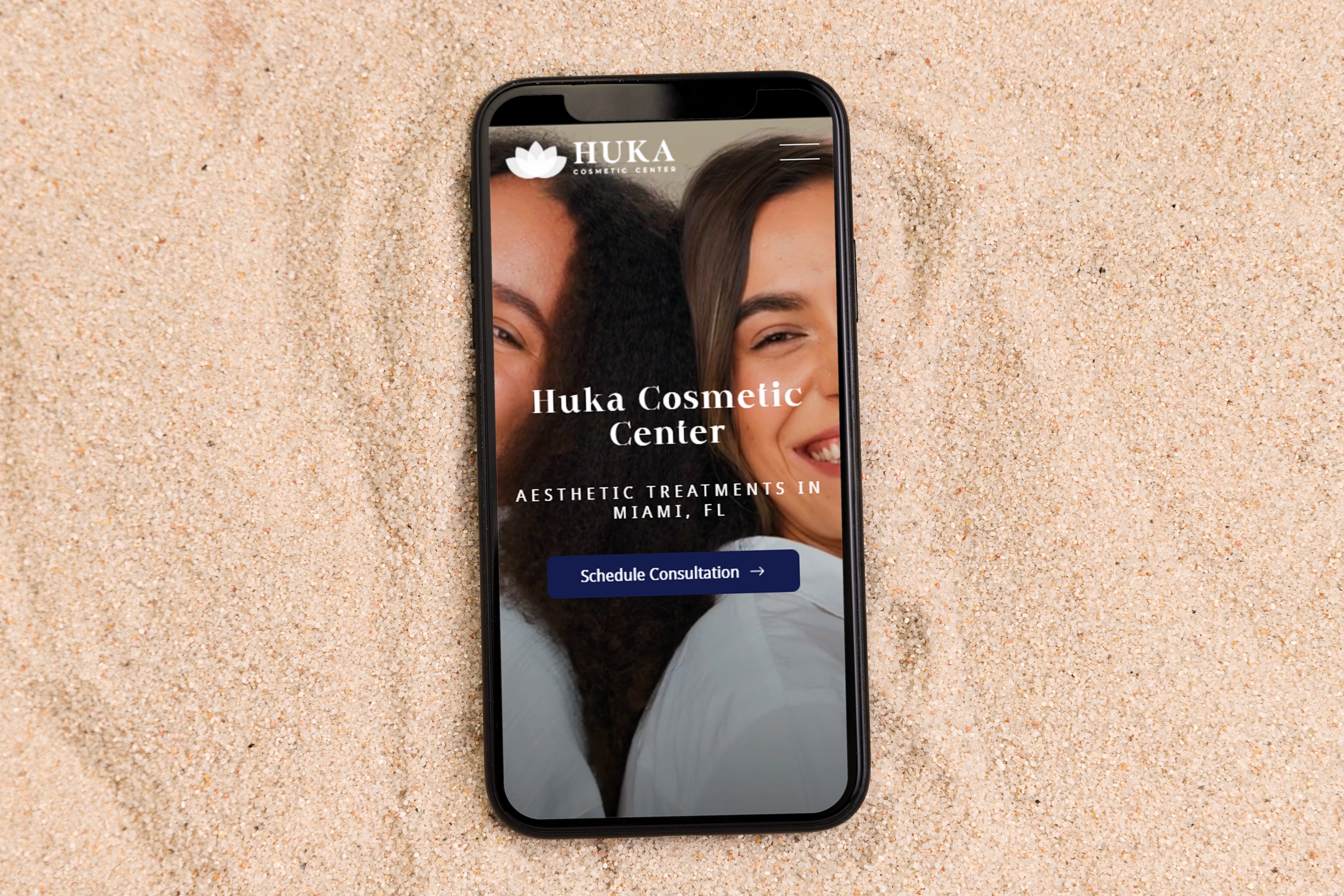 Huka Cosmetic's website being displayed on a smart phone.