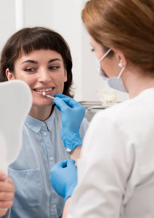 Dentist examining patient's teeth during routine dental checkup