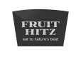 Black trapezoid-shaped object with text 'FRUIT HITZ' and 'eat to nature's beat' in white.