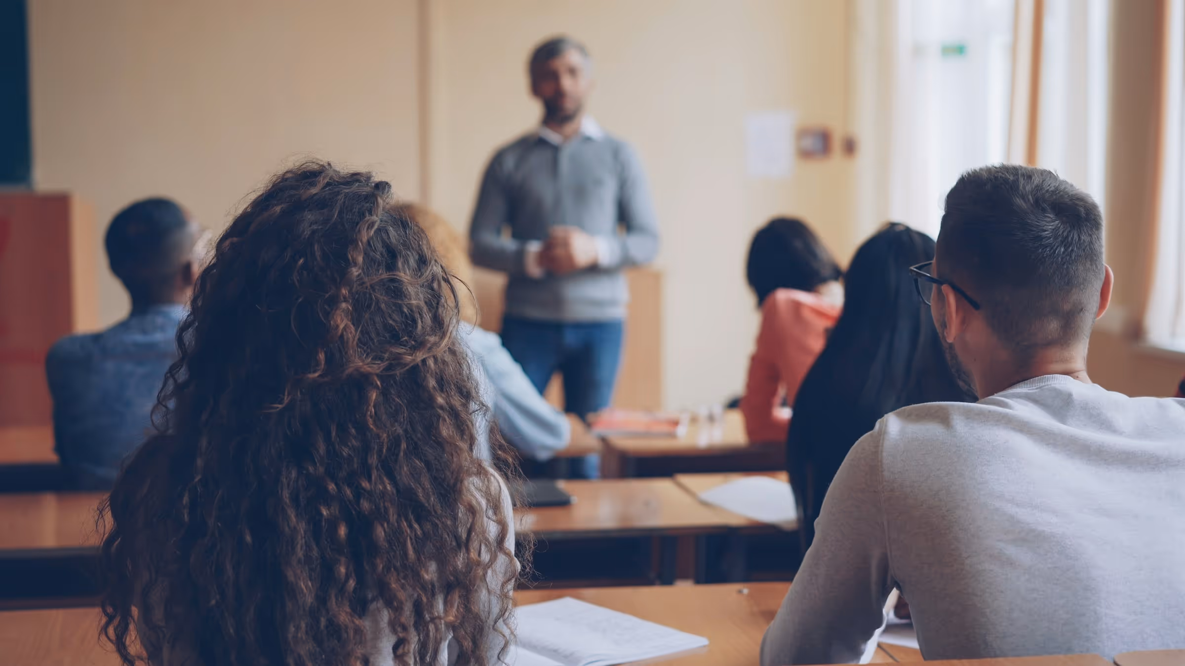 Students listen attentively to instructor during classroom lecture