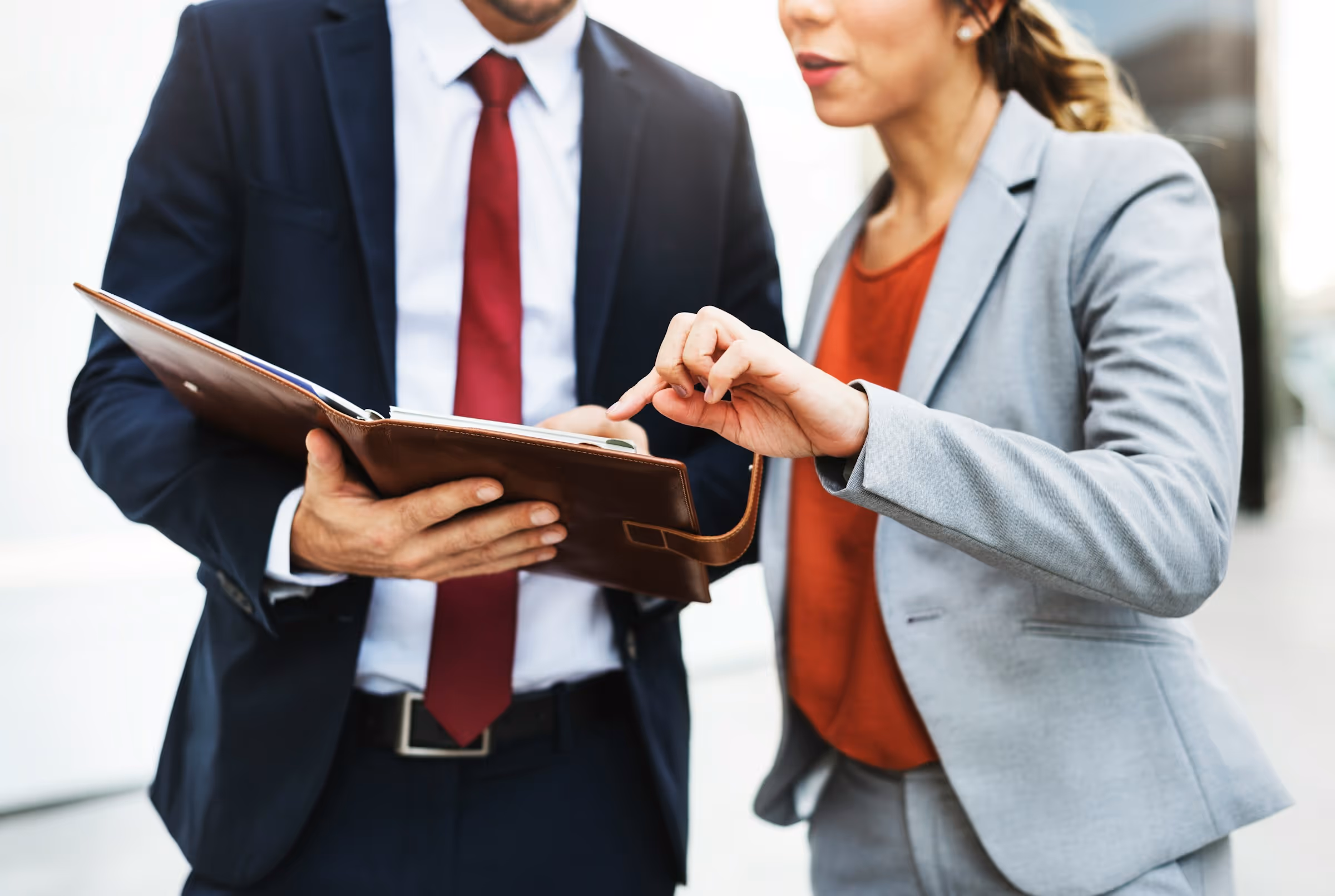 Business professionals reviewing document together in office setting