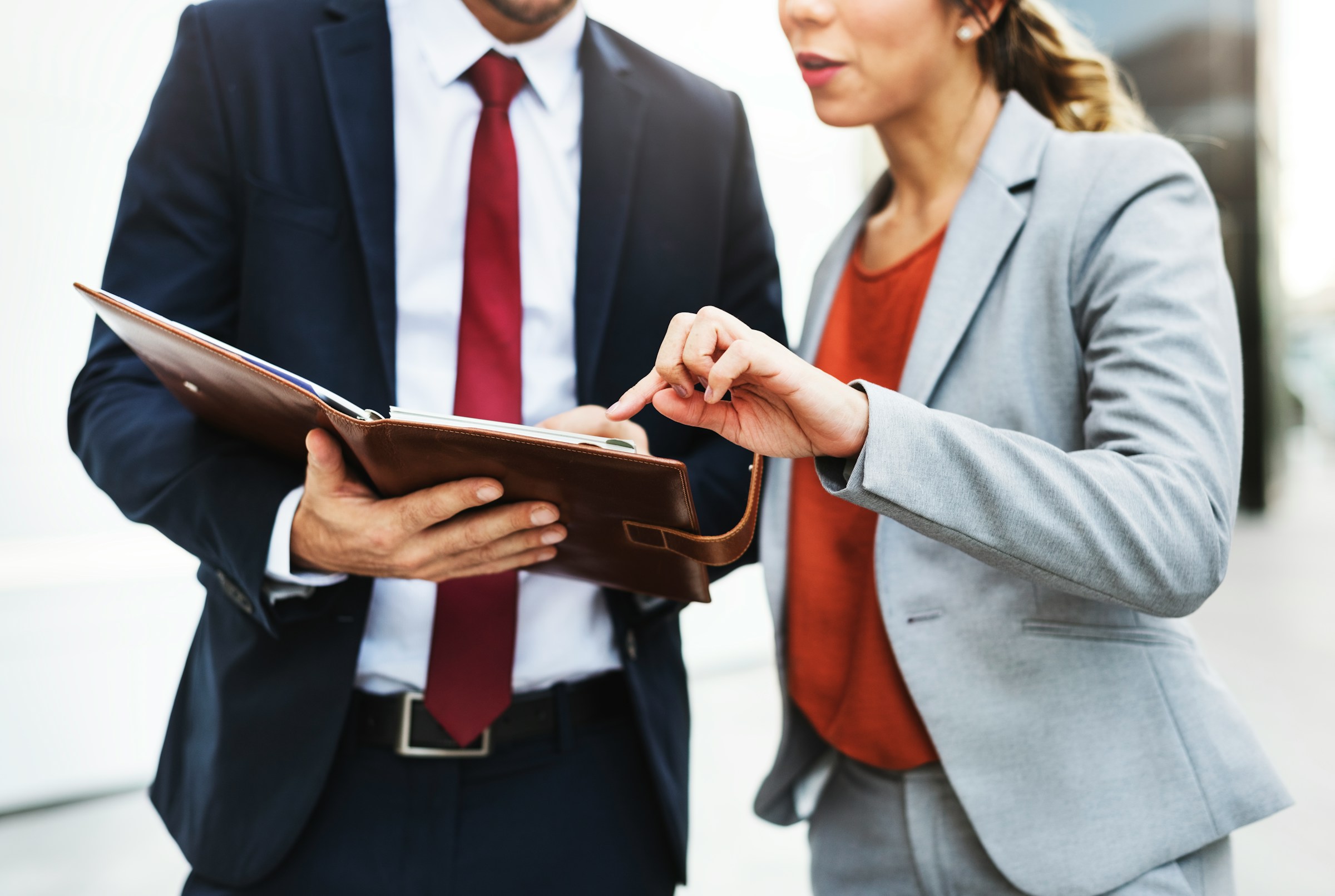 Business professionals reviewing document together in office setting