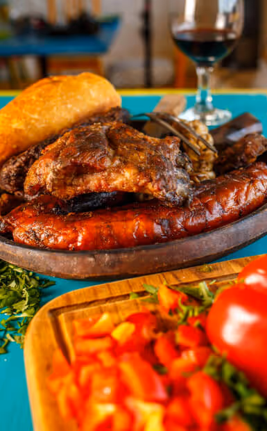 A plate of chicken next to some vegetables