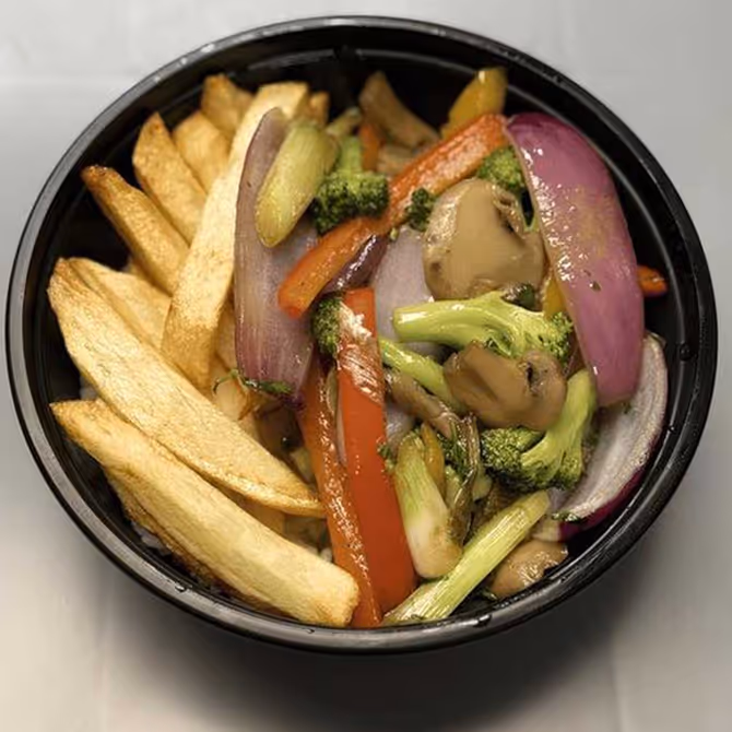 A bowl of flambéed peppers, onions, broccoli and mushrooms, all in soy glaze over white rice.